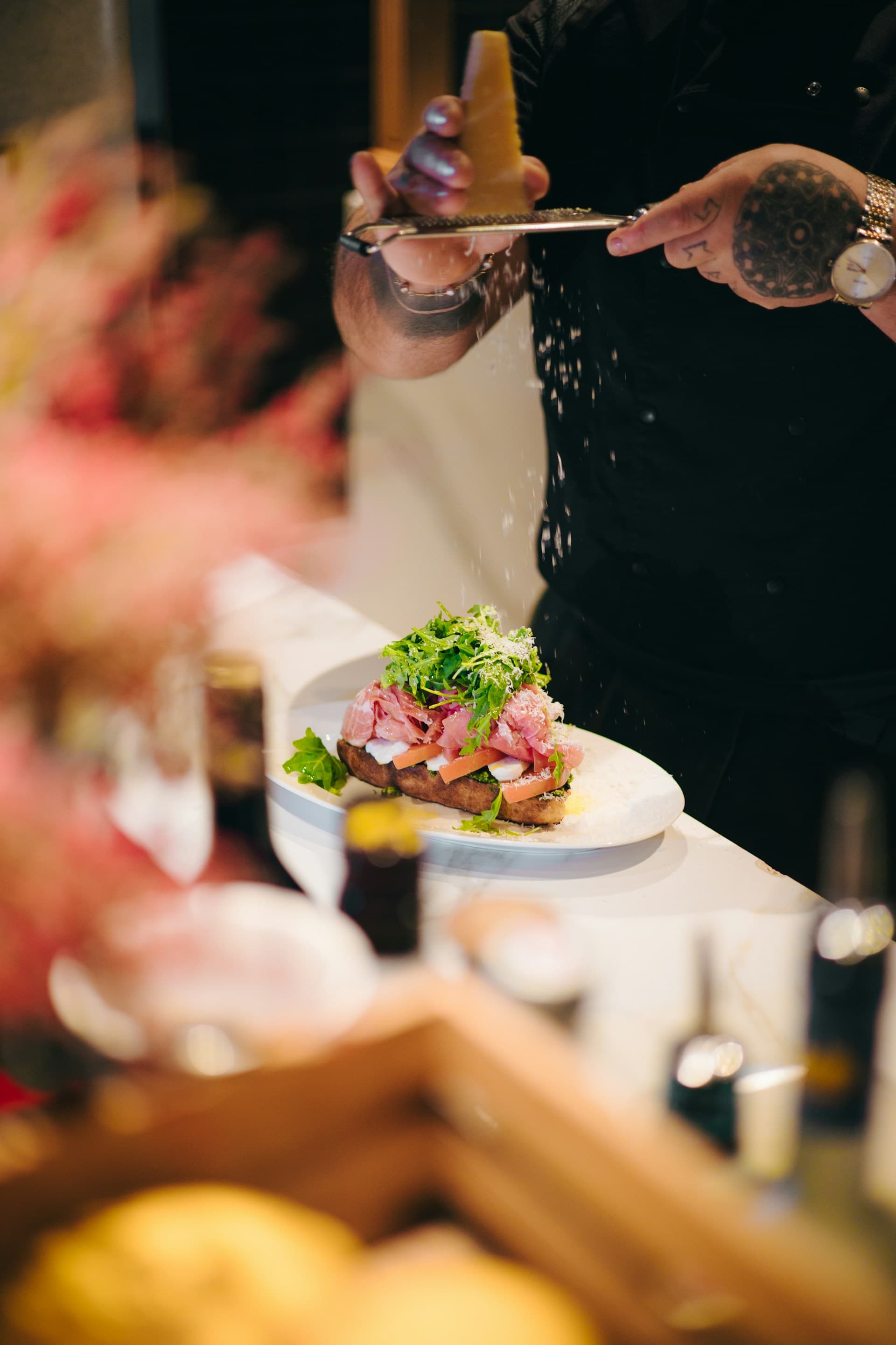 Finishing touches on a gourmet dish — bespoke menu catering for London events
