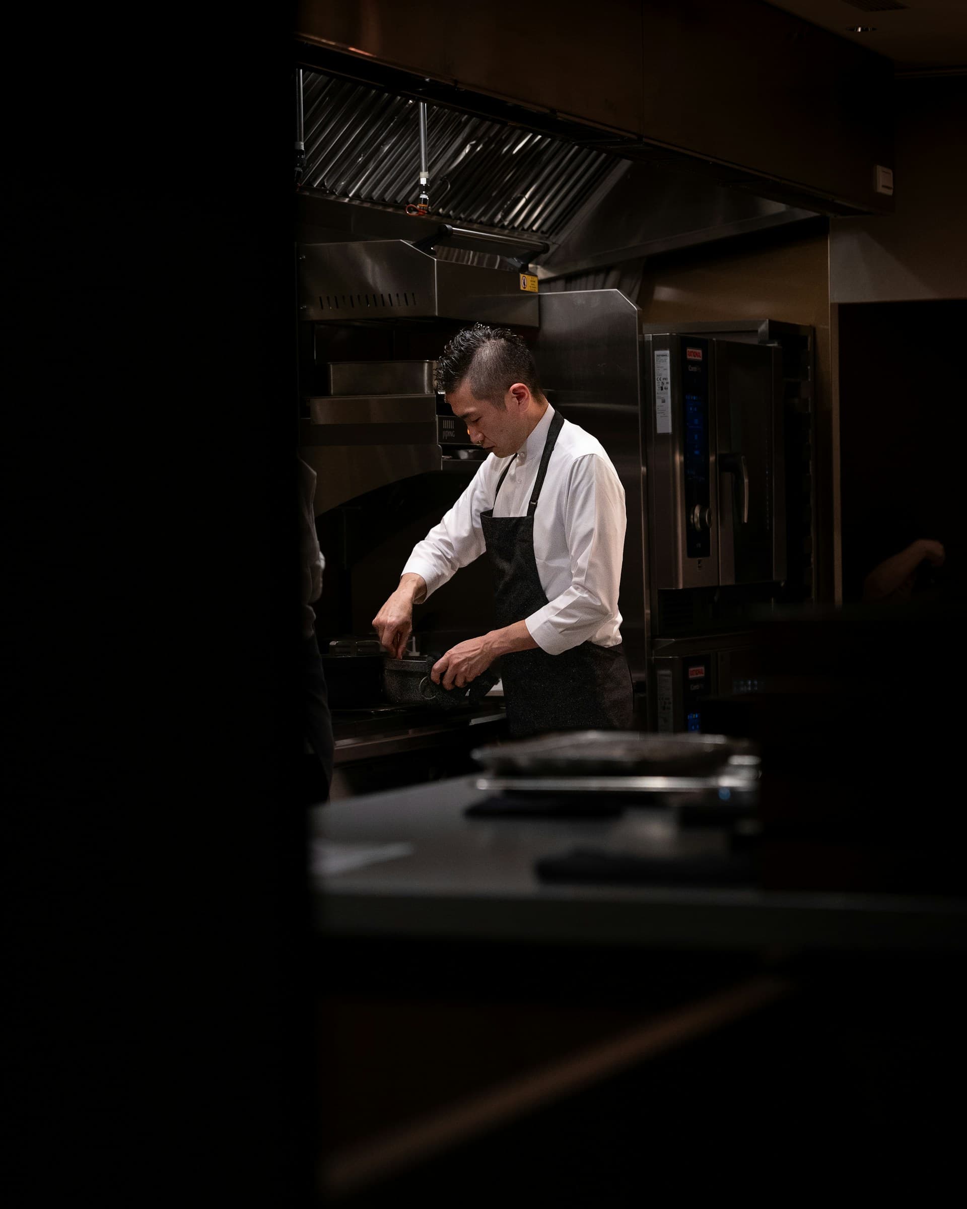 House of Nelle head chef preparing a bespoke dish in the kitchen